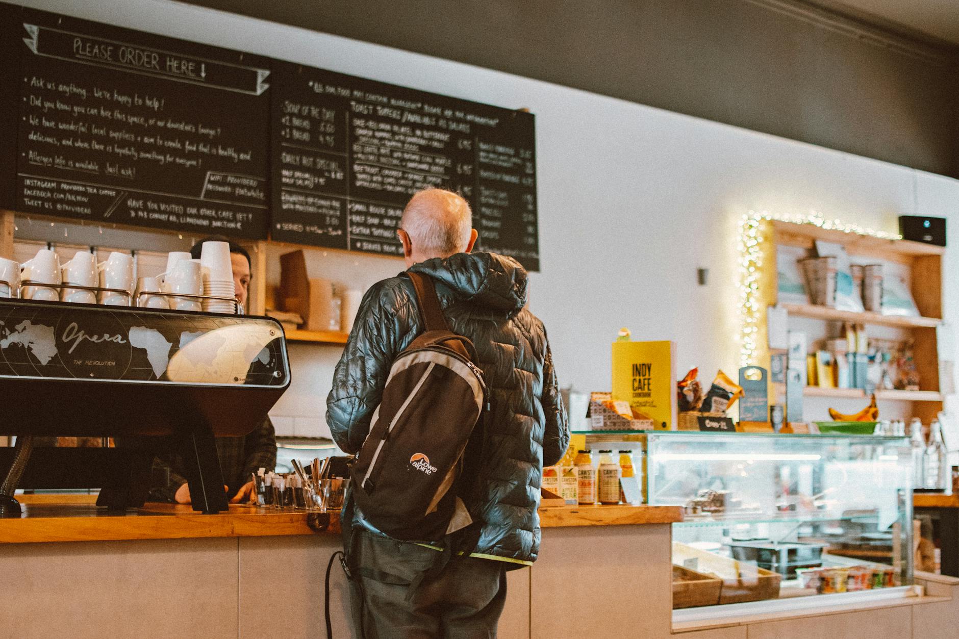 man standing in front of counter